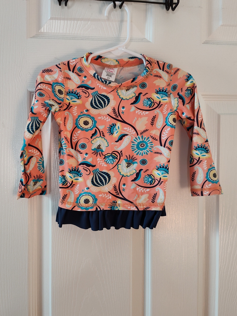 Ruffle Butts Peach Floral Rash Guard with Navy Accents
